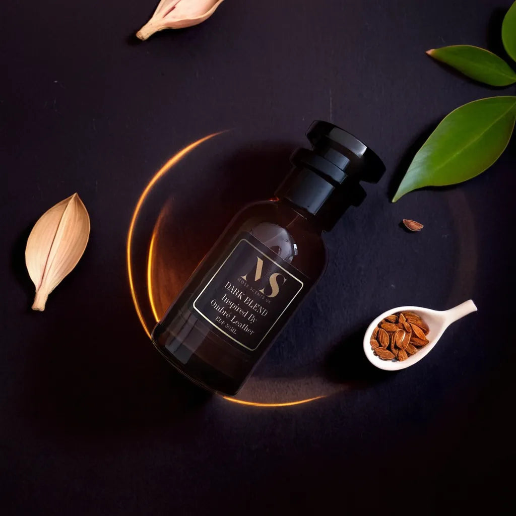 50 bottle of ombre leather inspired perfume surrounded with cardamom