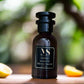 50 ML bottle of millesime imperial Inspired perfume - Vintange, surrounded with orange and lemon 
